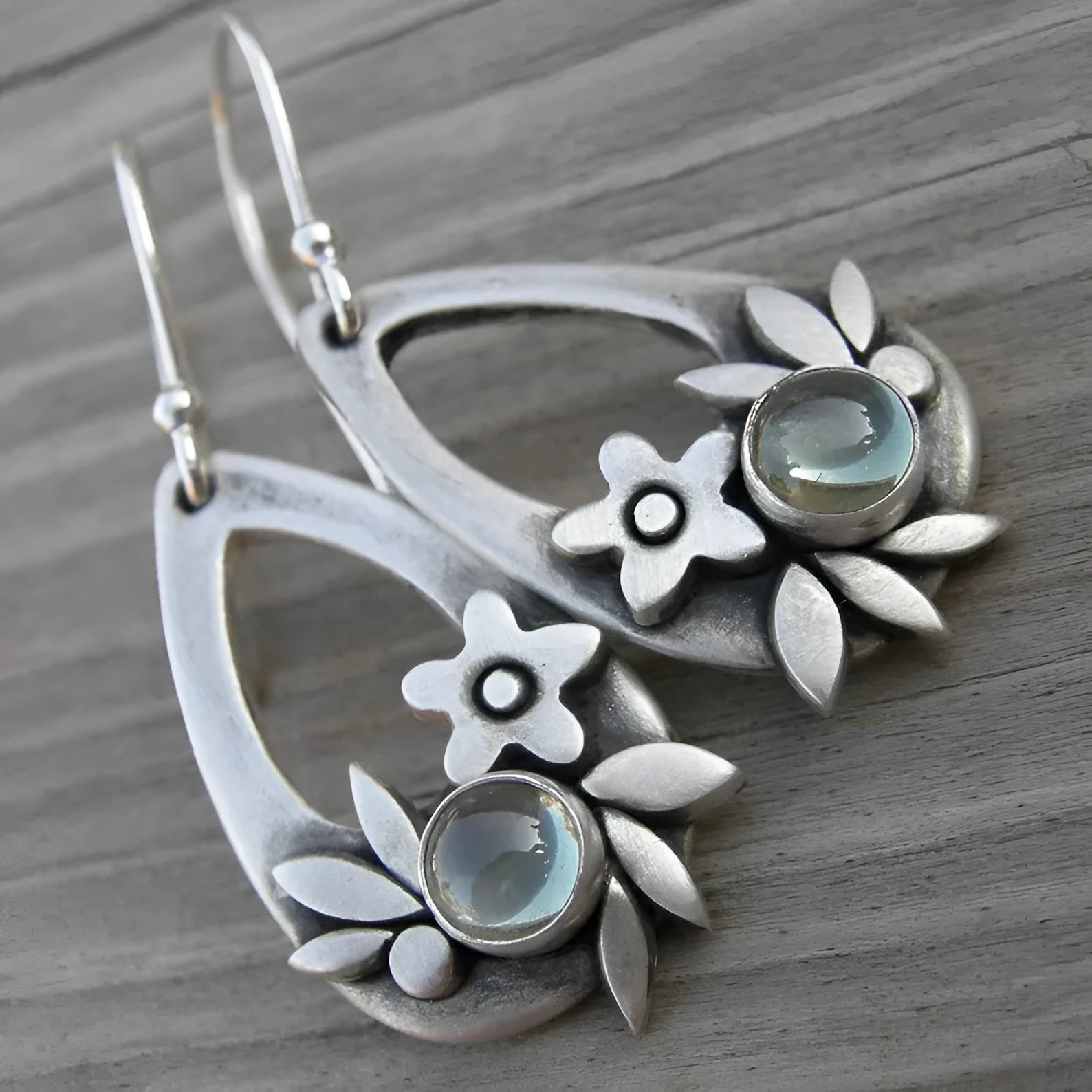 Silver alloy drop earrings with teardrop floral and leaf design