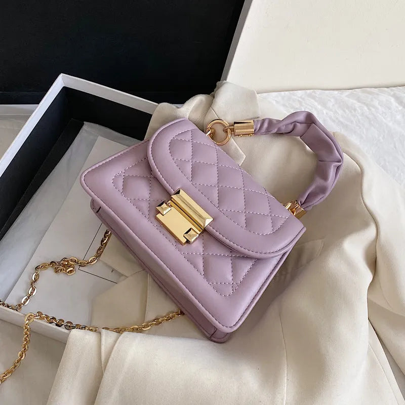 Korean-style rhombus shoulder bag in purple with crossbody strap and small square design