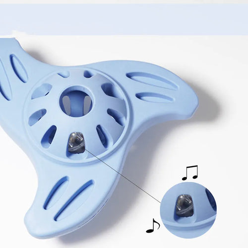 Blue boomerang-shaped dog chew toy with textured edges for dental stimulation