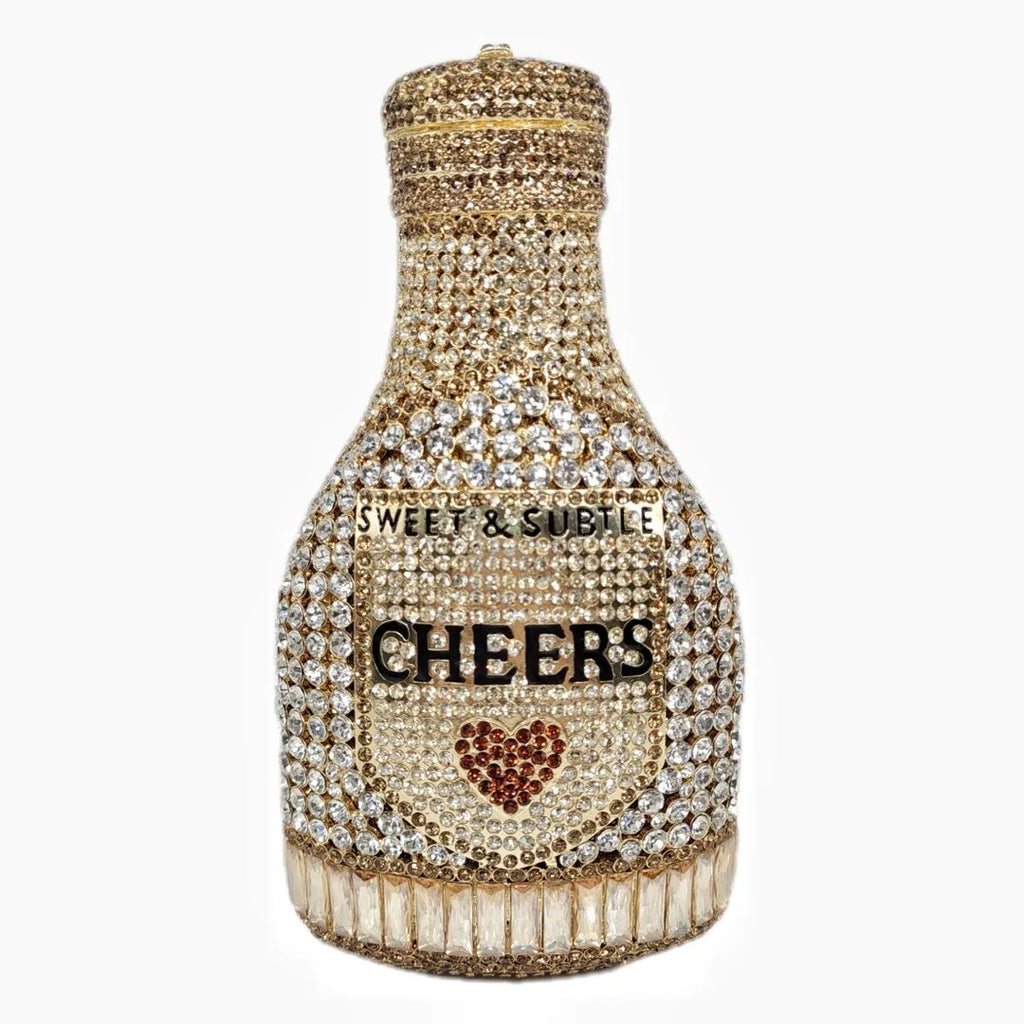 Champagne bottle shaped evening clutch with rhinestone details and metallic finish