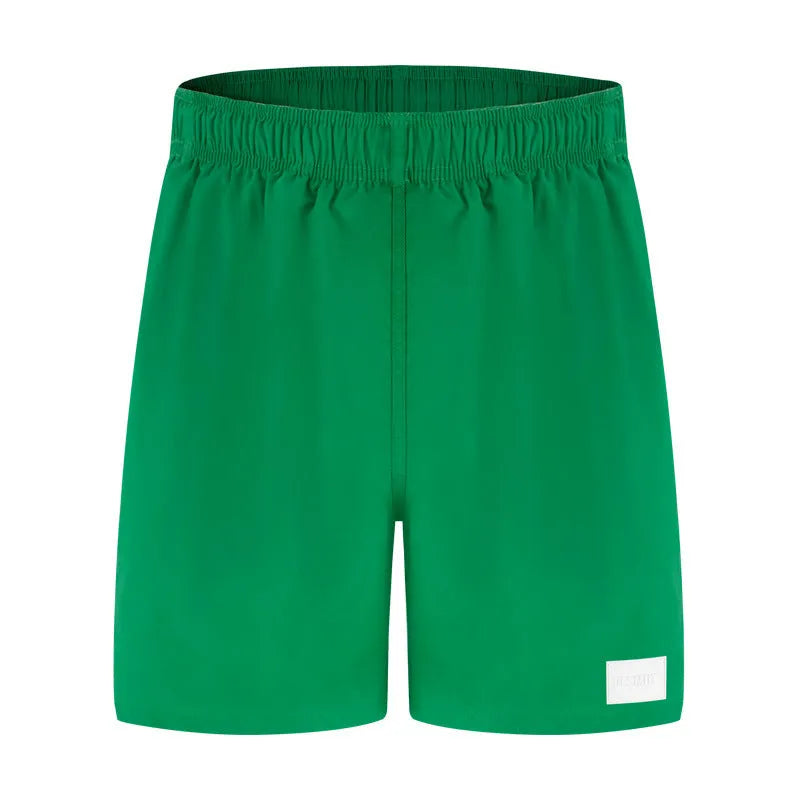 Men's quick-drying nylon shorts in solid colours with straight leg opening for beach and sports