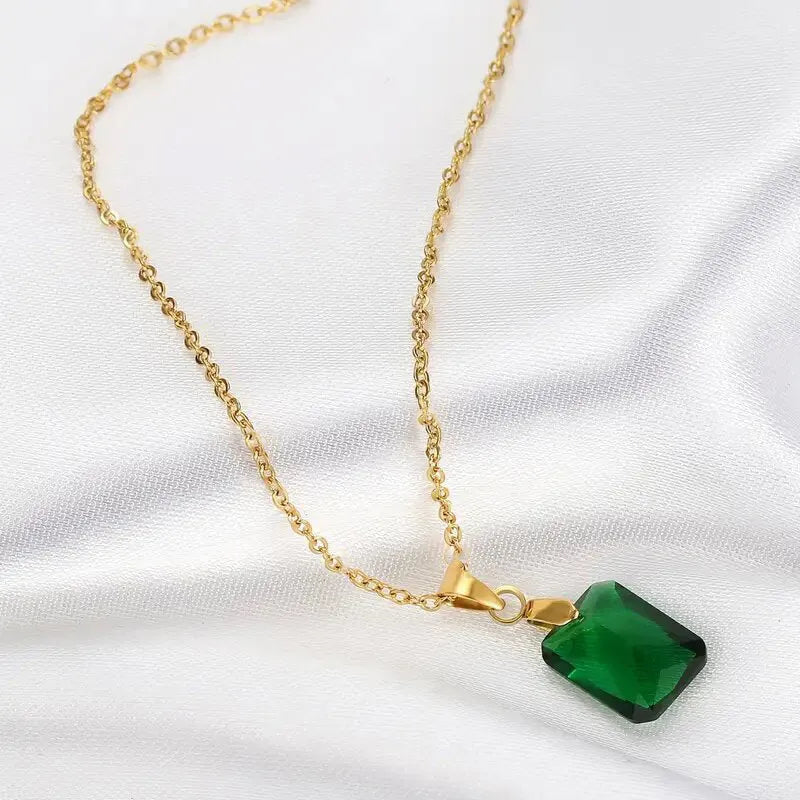 Rectangular copper pendant necklace with geometric quadrilateral design and green finish on O-ring chain.