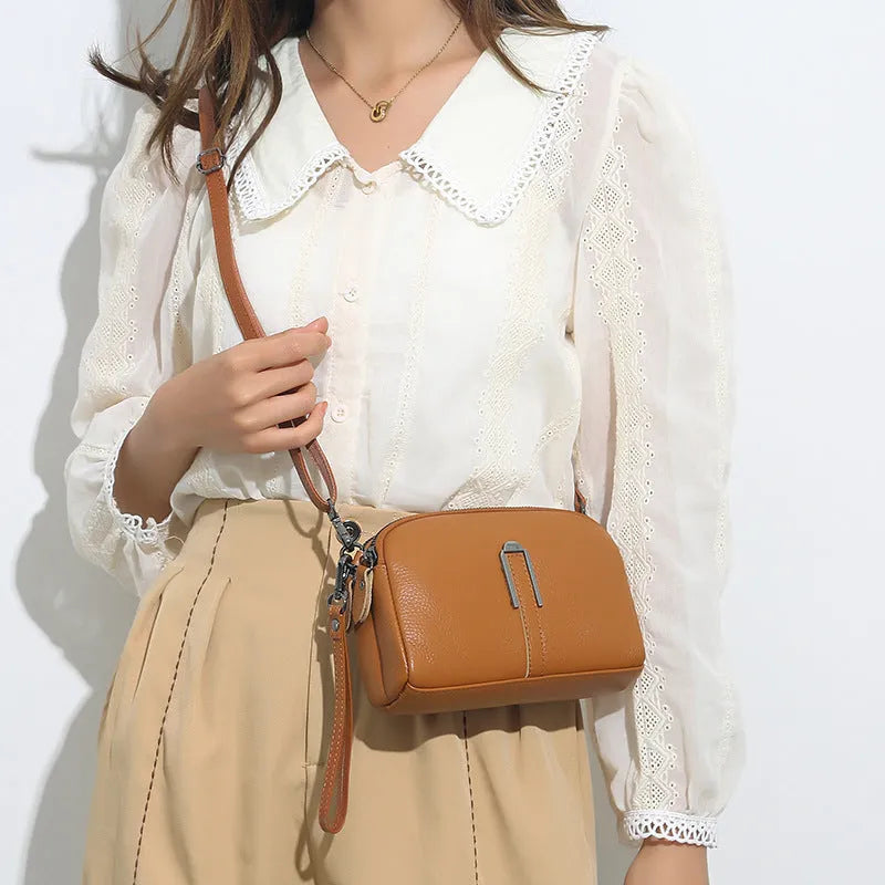Women's genuine leather square shoulder bag in dark khaki colour, showing its structured shape and shoulder strap.