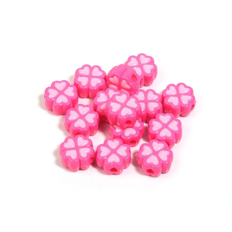 Acrylic four-leaf clover beads with frosted finish in mixed cartoon colours