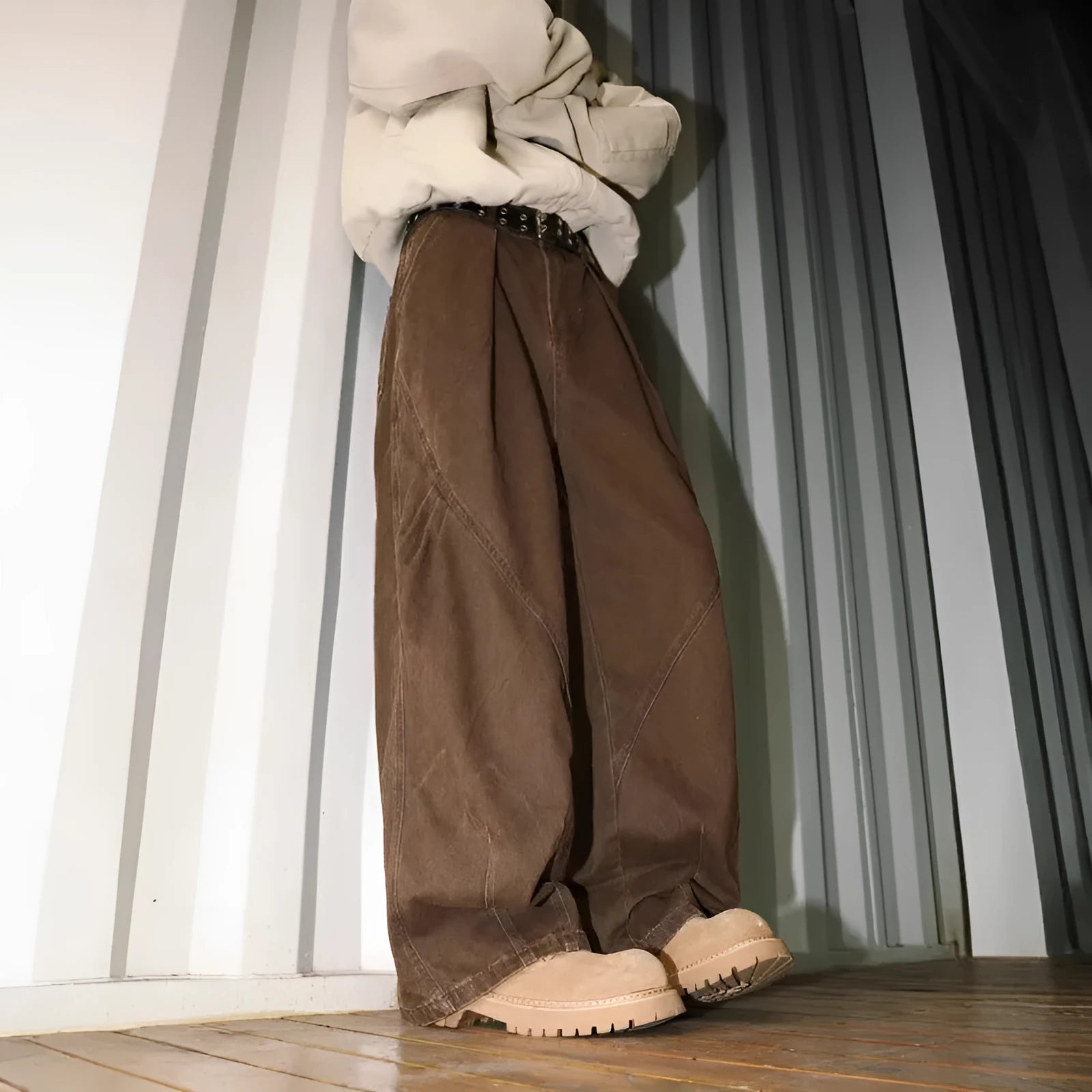 Men's pleated straight-leg trousers in apricot colour showing elasticated waistband detail.