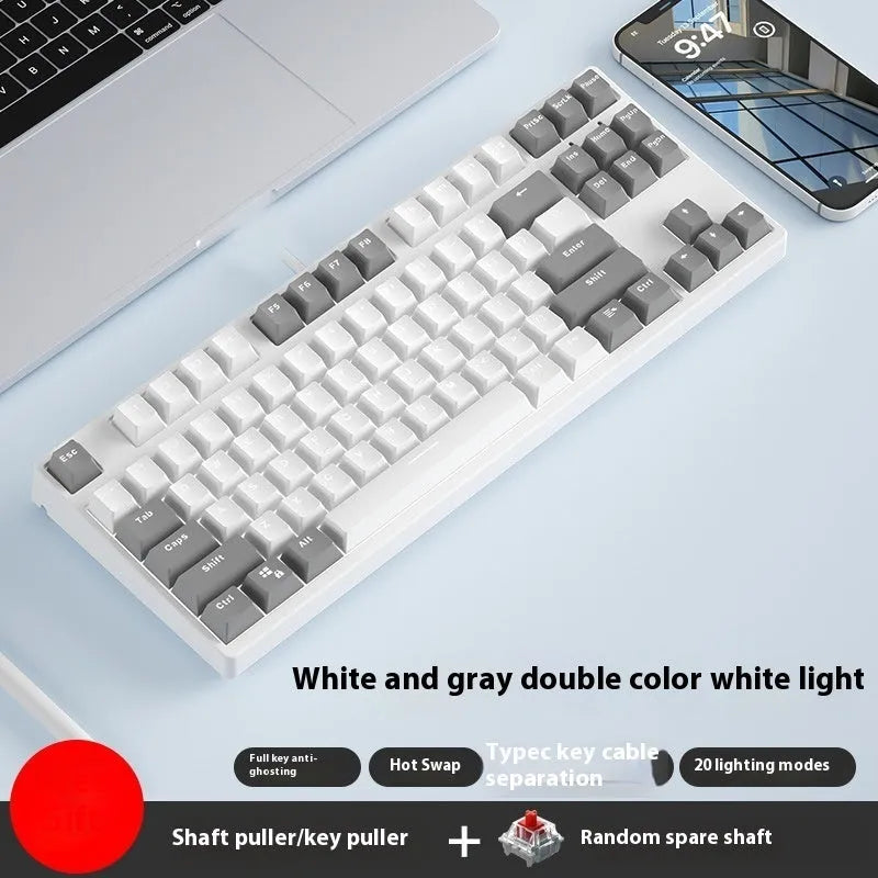 87-key wired mechanical gaming keyboard with hot-swappable switches shown in a two-tone colour scheme on a metal chassis.