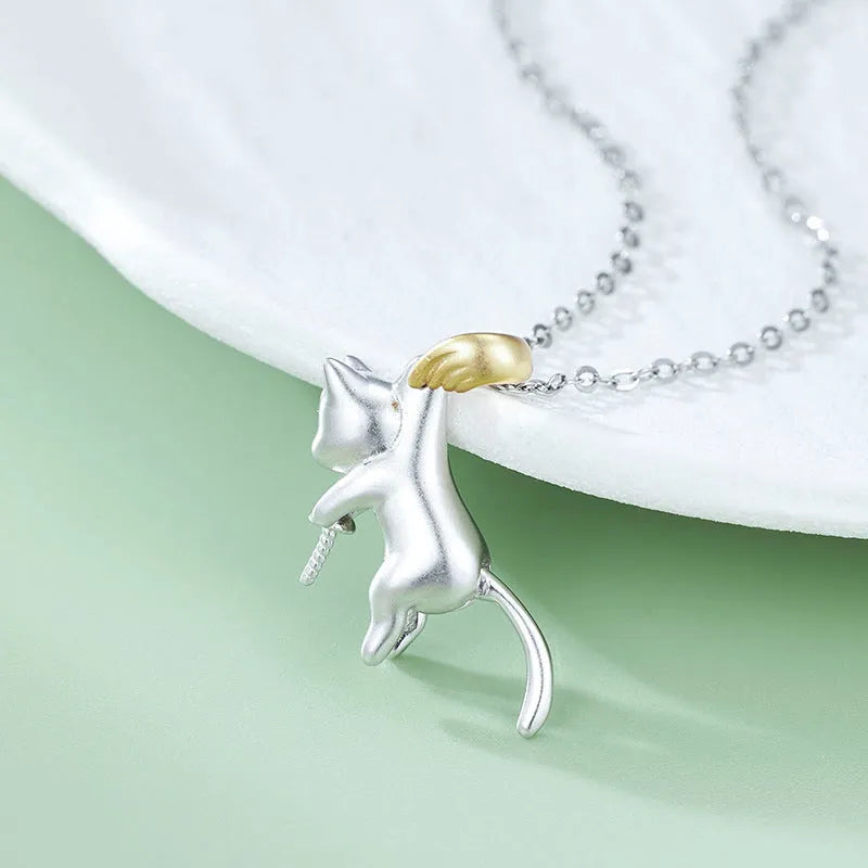 Sterling silver clavicle necklace with cat pendant on model, showing electroplated finish and professional styling