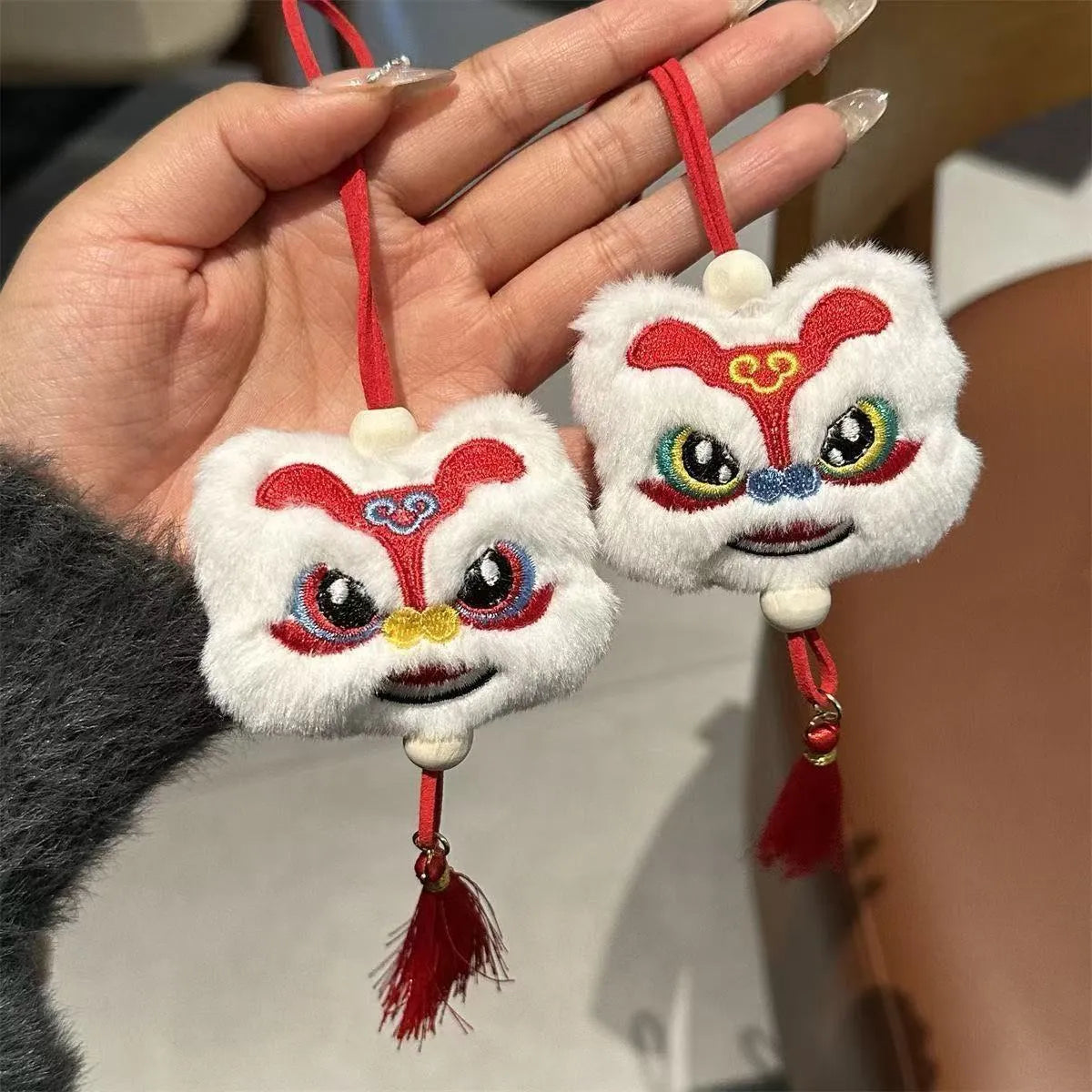 Chinese style plush lion tassel keychain ornament with star stone detail in blue or yellow