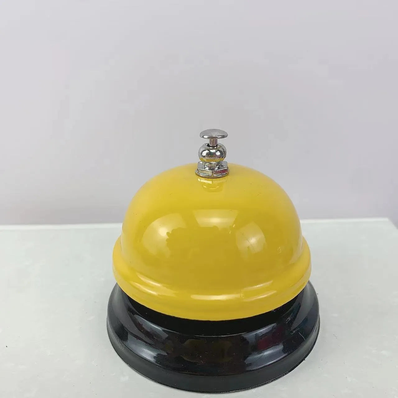 Iron game bell in various colours for classroom and restaurant use