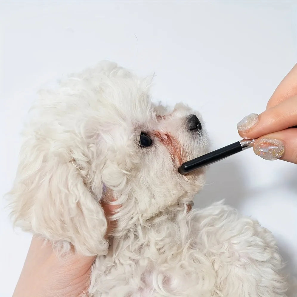 Black pet grooming brush with soft tear stain remover and comb attachment for dogs and cats