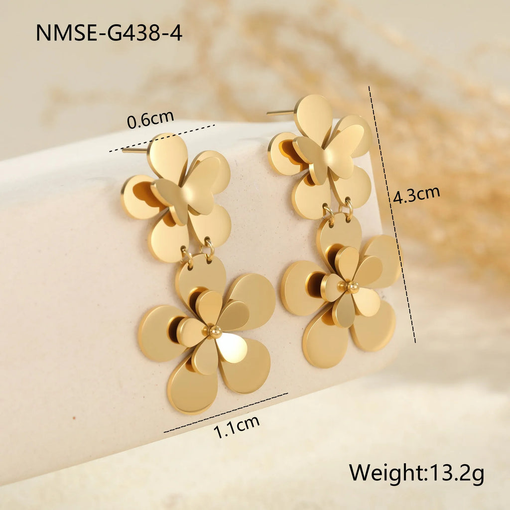 Gold-coloured butterfly earrings with flower and geometric designs for women