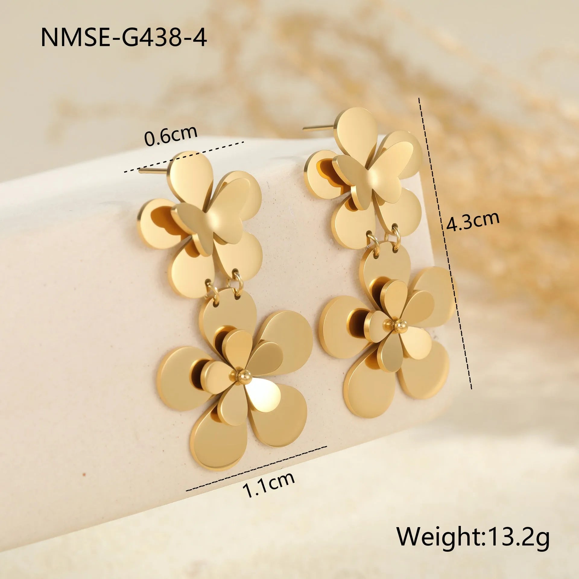 Gold-coloured butterfly earrings with flower and geometric designs for women