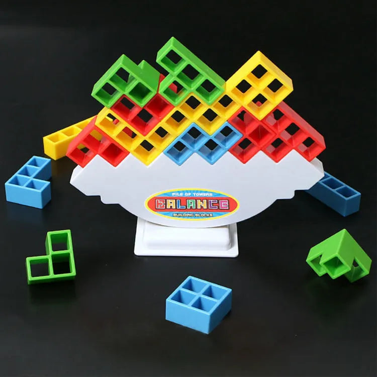 Plastic balance stacking board game with 16 colourful blocks, chassis, and base in a 26.5cm square box.