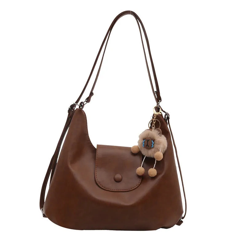 Women's black PU leather horizontal square shoulder bag with single strap and internal phone pocket