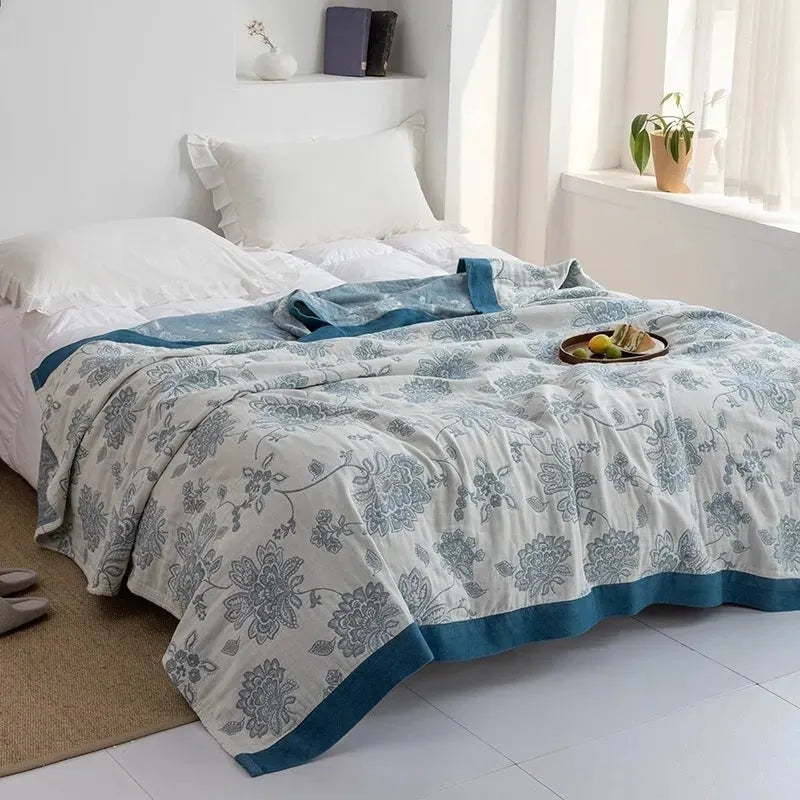 Roulette Wheel Blue five-layer gauze pure cotton blanket on bed showing modern simple pattern