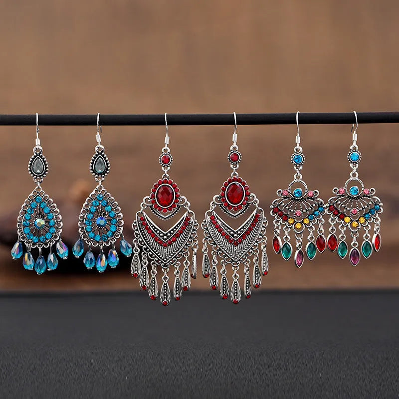 Retro purple drop earrings with long fringe detailing and ethnic design elements