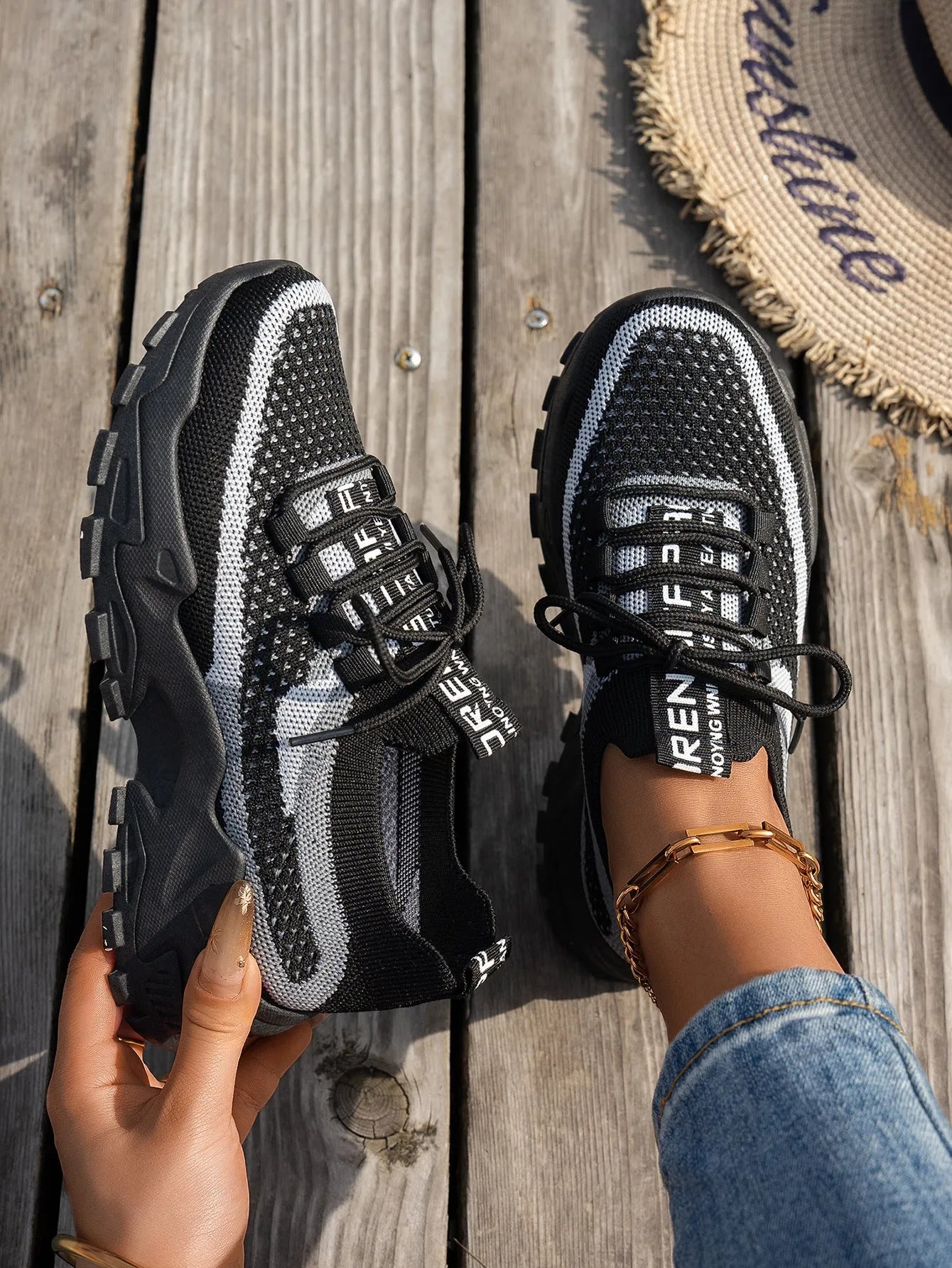 Women's Flyknit lace-up sneakers in a selected colour with a low rubber sole and round toe