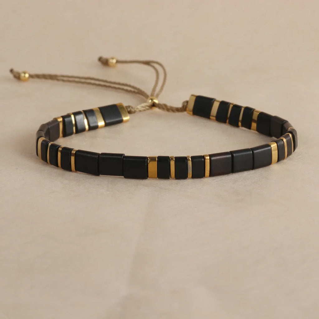 Geometric glass pull bead bracelet in five colour options on wrist