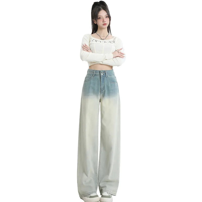 Women's gradient blue straight-leg denim trousers on a model, showing the ombré colour effect.