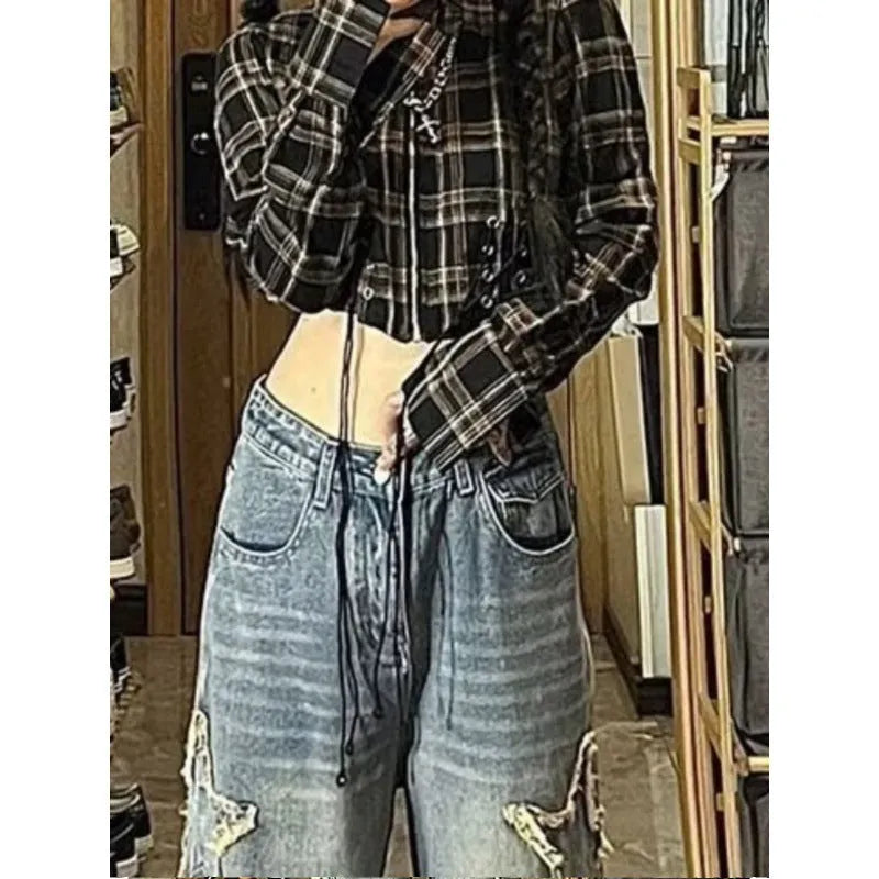 Blue high-waisted wide-leg women's jeans made from cotton denim on a model.