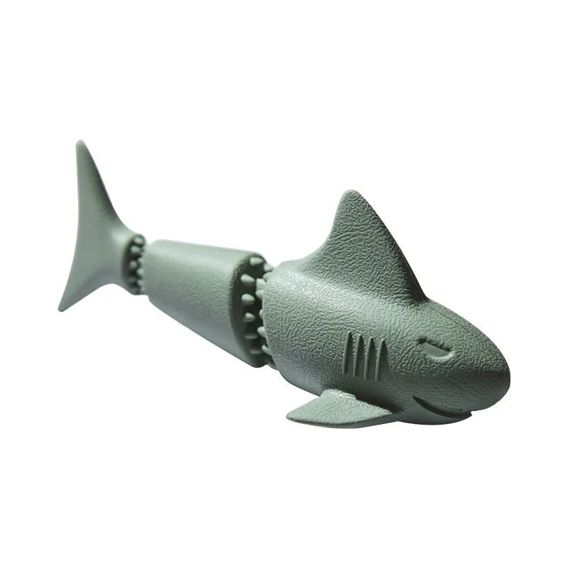 Blue rubber dog toy shaped like a shark conch for food dispensing and chewing.