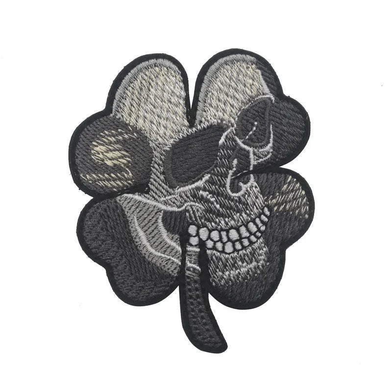 Outdoor embroidered fabric badge with Velcro backing on a tactical vest.