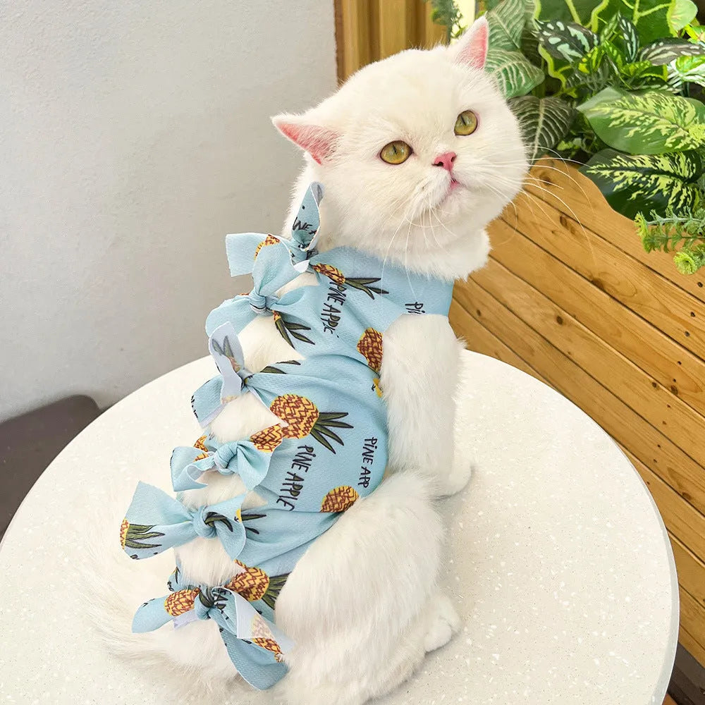 Lace-up polyester cat sterilisation recovery garment shown in blue, brown, green pineapple, pink, or purple