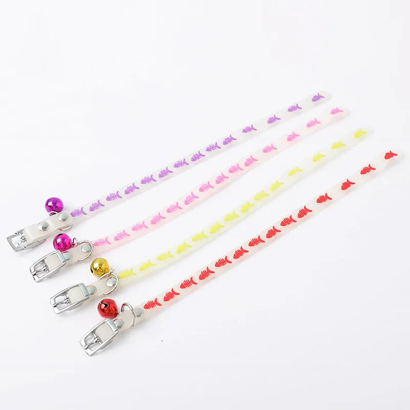 Luminous cat collar with adjustable silicone strap and metal bell in paw print pattern