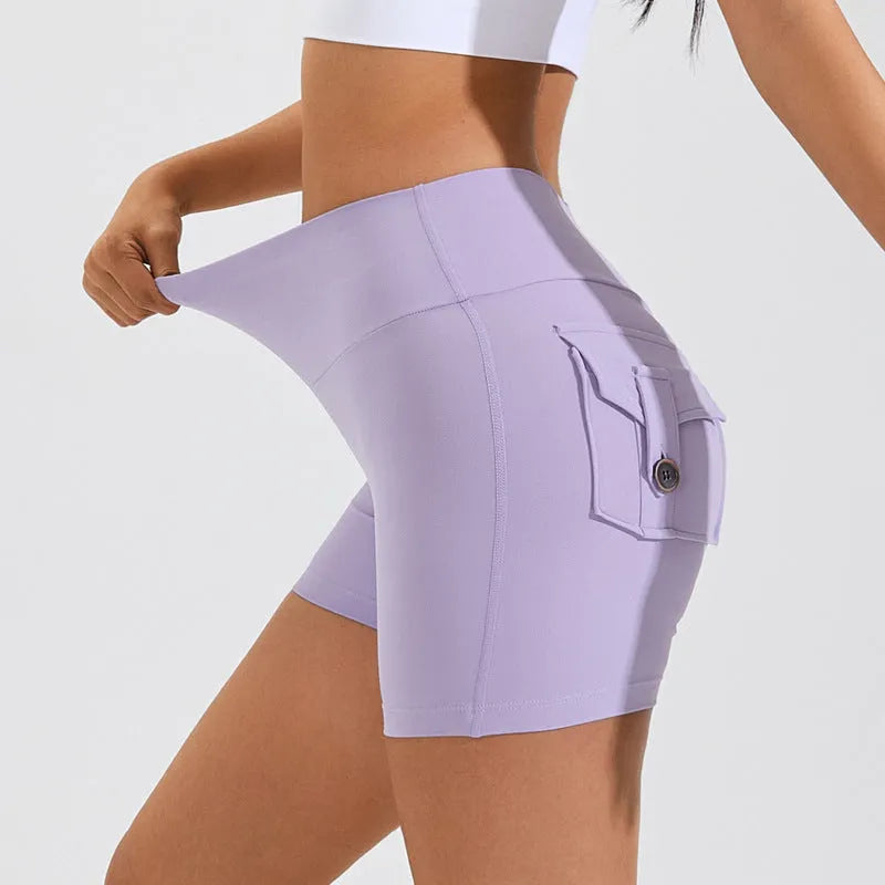 Women's high waist hip lifting fitness shorts in Electric Blue with side pockets.