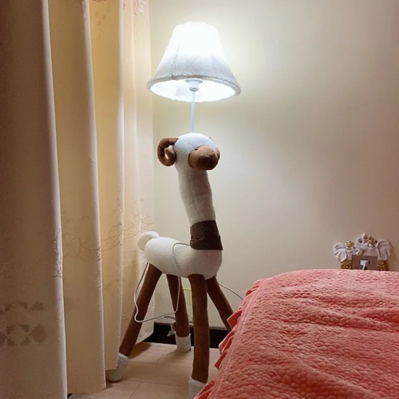 Hand-knitted cloth children's cartoon floor lamp with Christmas deer or lion design in a bedroom setting