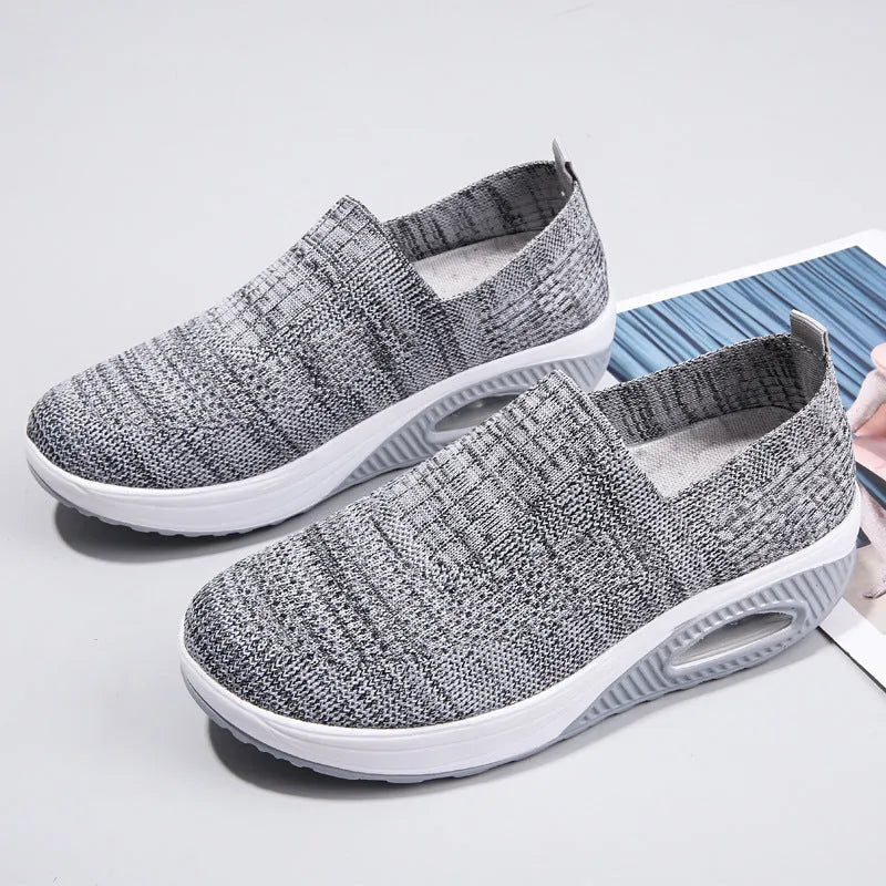 Women's mesh running shoes in beige with round toe and air cushion midsole.