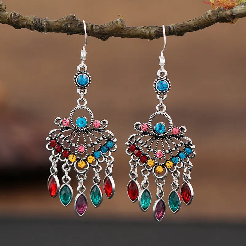 Retro purple drop earrings with long fringe detailing and ethnic design elements