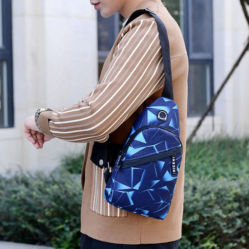 Blue print sling chest bag with a crossbody strap, showing the earphone hole and zipper opening.