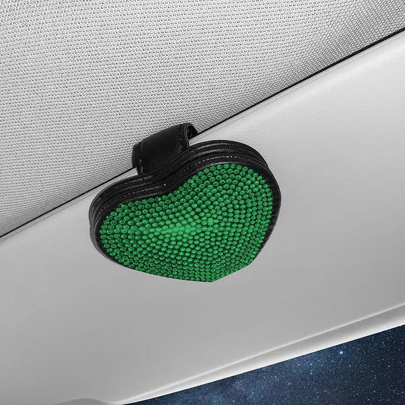 Black diamond-encrusted PU leather magnetic storage clip for car sun visor, holding sunglasses.