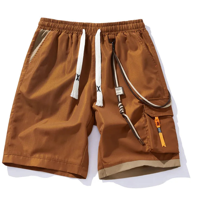 Man wearing loose-fitting black bamboo fibre sports shorts with a straight-leg cropped cut.