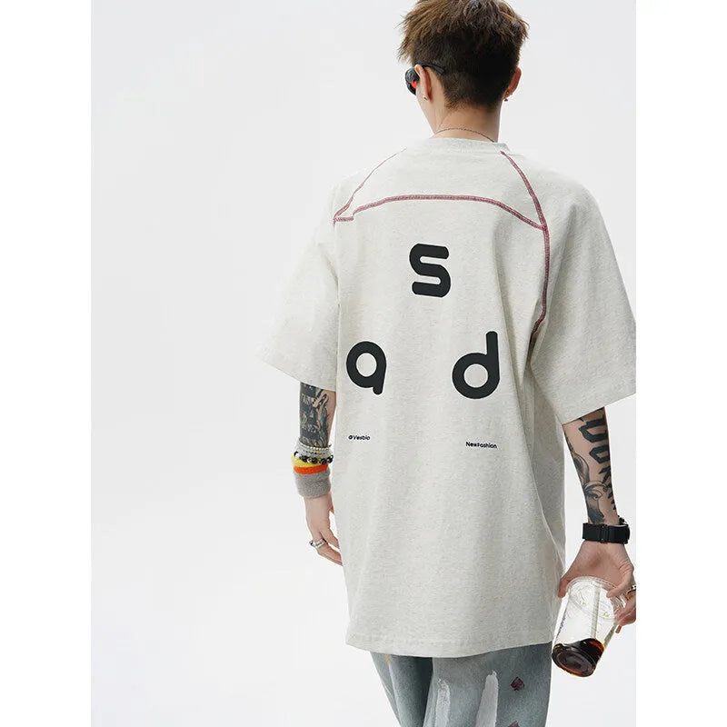 Men's loose fit black cotton t-shirt with a letter print on the front, short sleeves, and a round neck.