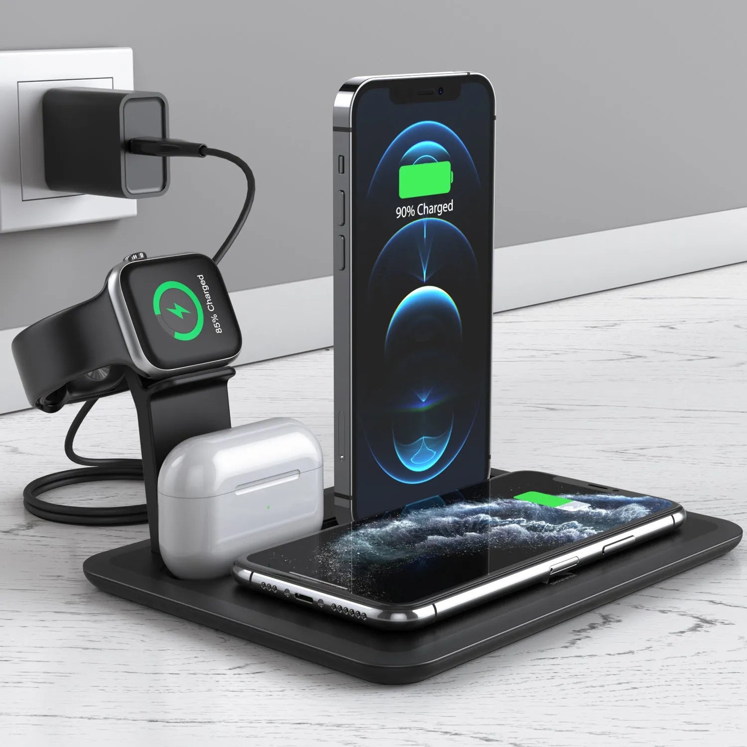 Black and white wireless desktop charging station for phone, headphones and watch on a desk