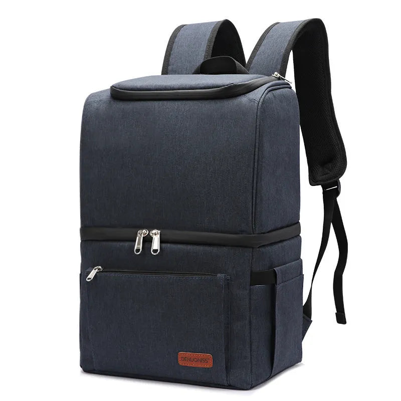 Blue double-layer insulated waterproof backpack cooler with 22 litre capacity shown outdoors.