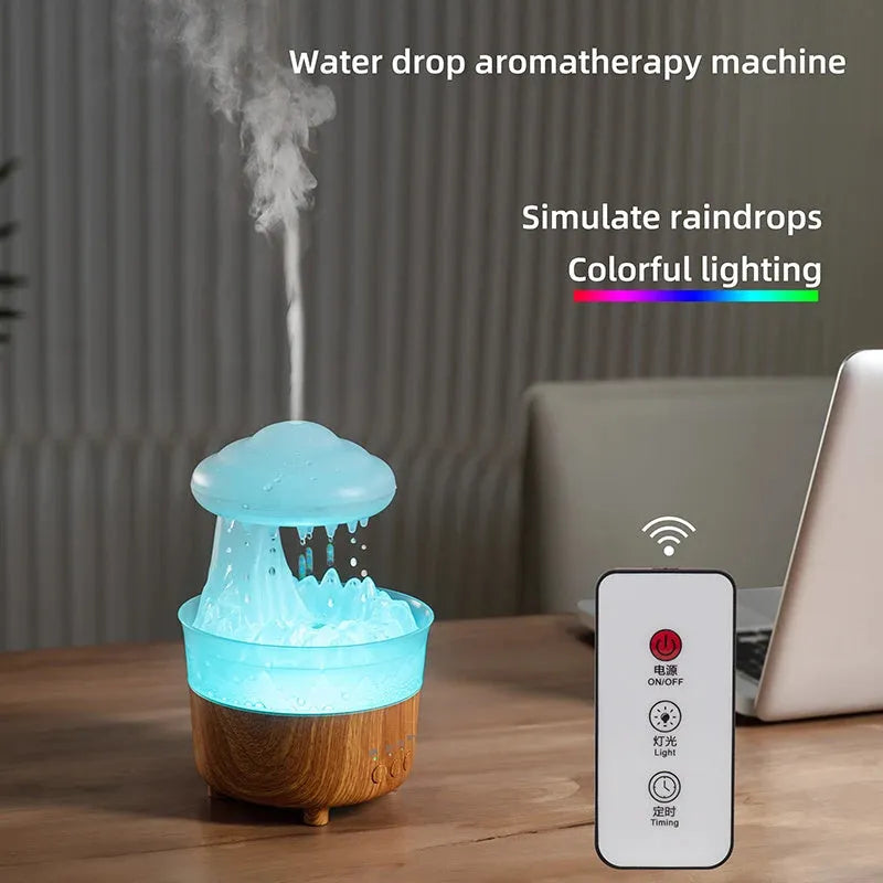 Wood grain green rain cloud shaped humidifier diffuser with coloured LED light on a table.