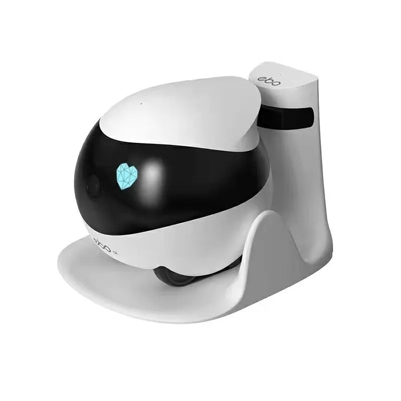White mobile surveillance robot camera with wheels next to its automatic charging docking station