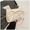 Women's underarm crossbody bag in horizontal square shape with sewing line details and phone pocket