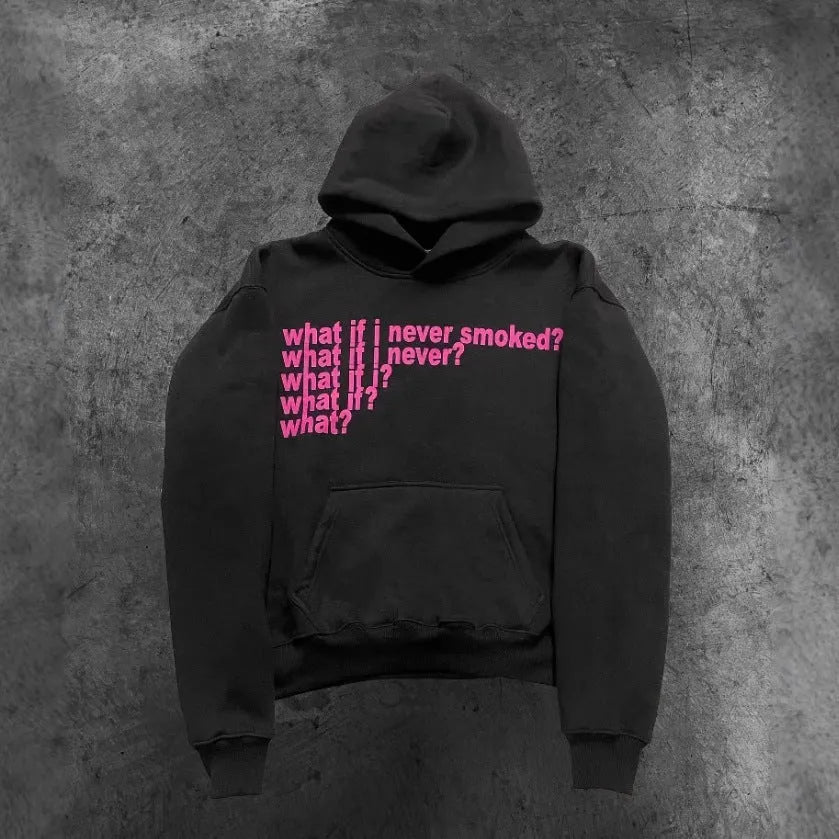 Man wearing a black heavyweight hooded sweater with a large white letter print design on the front.