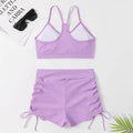 Women's high waist split swimsuit in black or purple colours with sleeveless design