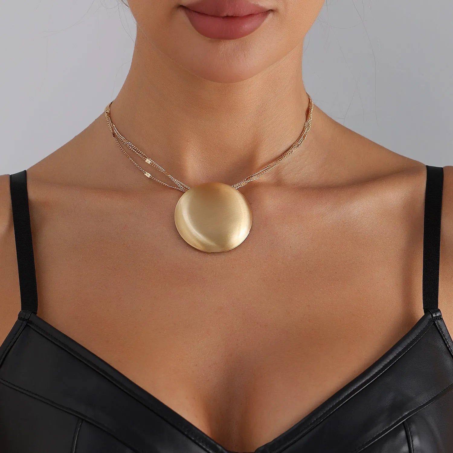 Gold electroplated alloy vintage geometric round pendant necklace with love heart motif on clavicle chain