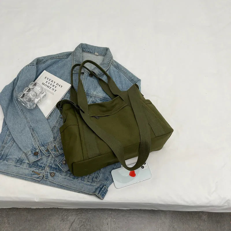 Women's canvas-style polyester shoulder bag with sandwich pocket and phone compartment in solid colour