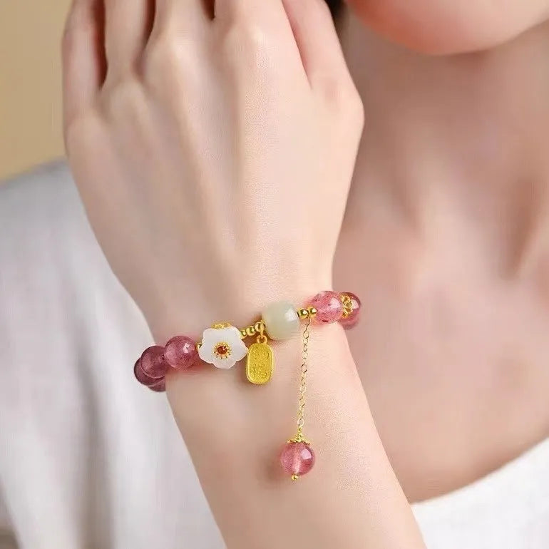 Handmade strawberry quartz crystal bracelet with Hetian jade peach blossom design showing five style variations