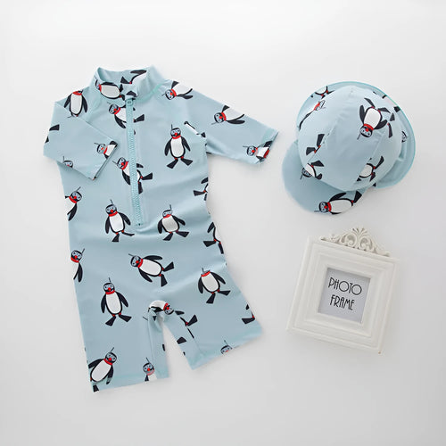 Boys' penguin pattern swimsuit set with long sleeves and matching swimming cap