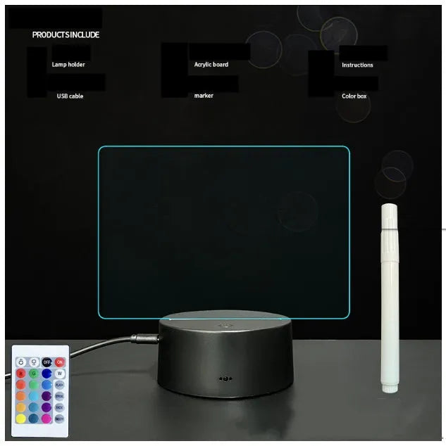 Black 3D acrylic message board night light on desk with remote control and stylus.