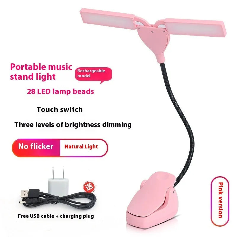 Black rechargeable music stand lamp with 28 LED lights and USB cable on a music stand.