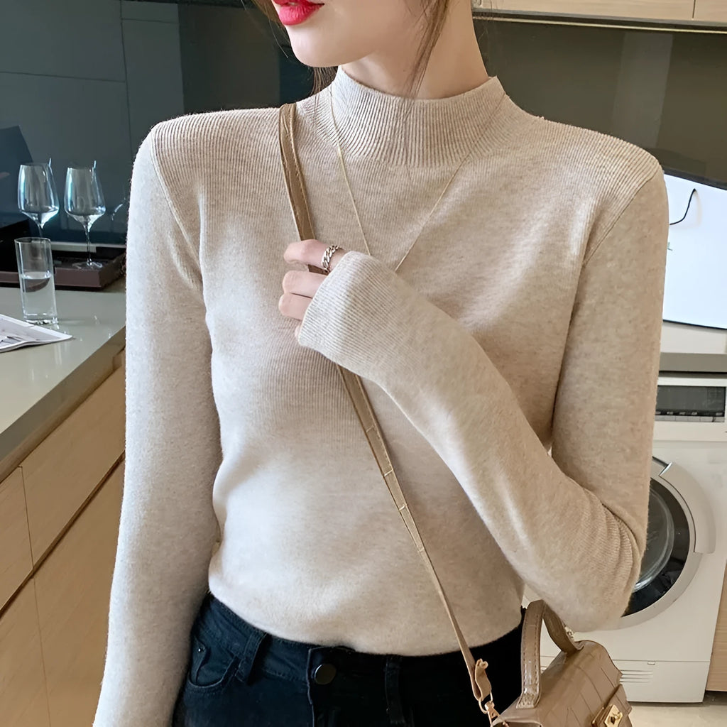 Women's slim fit knitted bottoming shirt in viscose fibre with long sleeves, shown in apricot colour